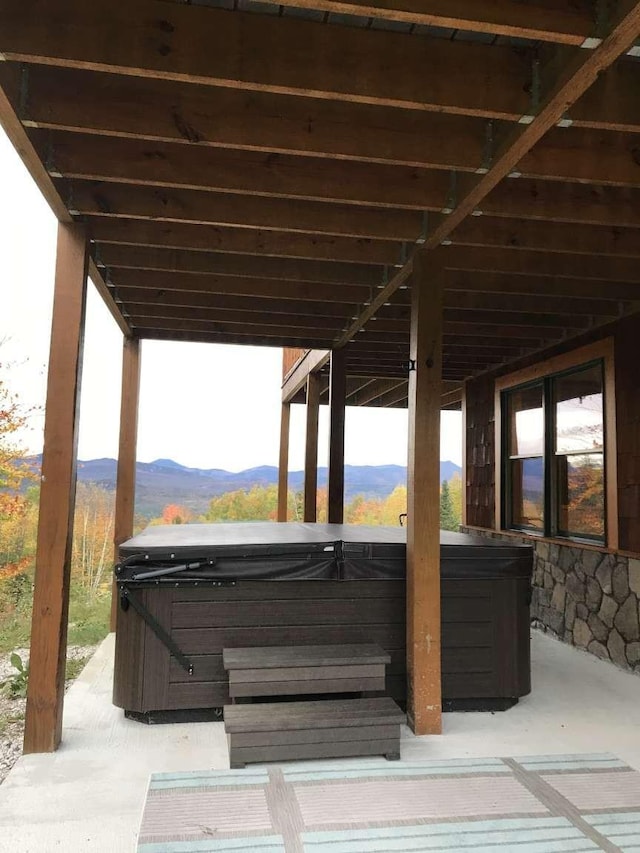 42 Peak Vista Ln, Madison, NH 03849 - view of patio / terrace featuring a hot tub and a mountain view