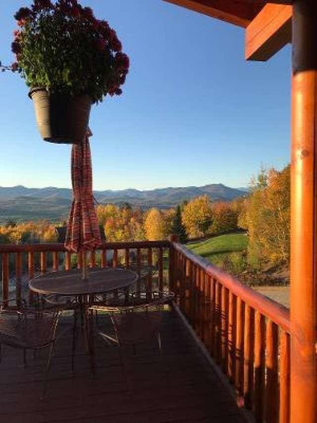 42 Peak Vista Ln, Madison, NH 03849 - wooden deck with a mountain view and outdoor dining space