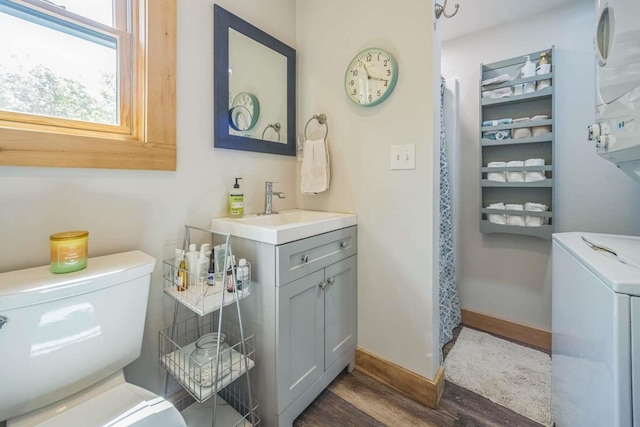42 Peak Vista Ln, Madison, NH 03849 - bathroom with washer / clothes dryer, toilet, wood finished floors, and vanity