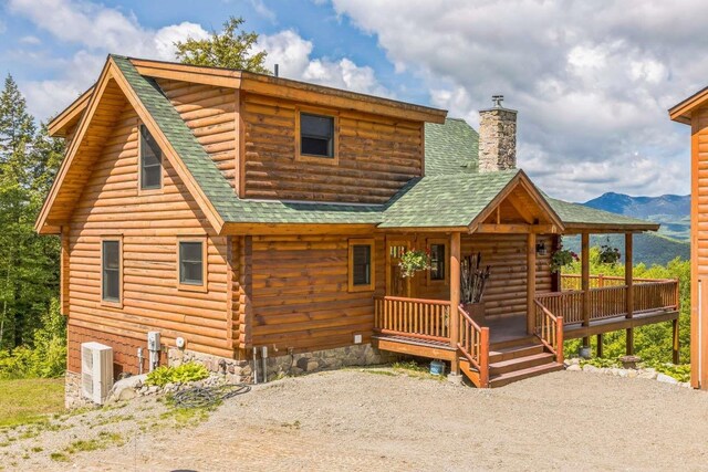 42 Peak Vista Ln, Madison, NH 03849 - log cabin featuring roof with shingles, a chimney, covered porch, log siding, and cooling unit