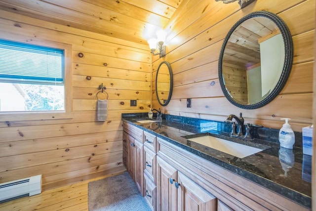 42 Peak Vista Ln, Madison, NH 03849 - full bath with a baseboard heating unit, wood walls, wood ceiling, double vanity, and wood finished floors