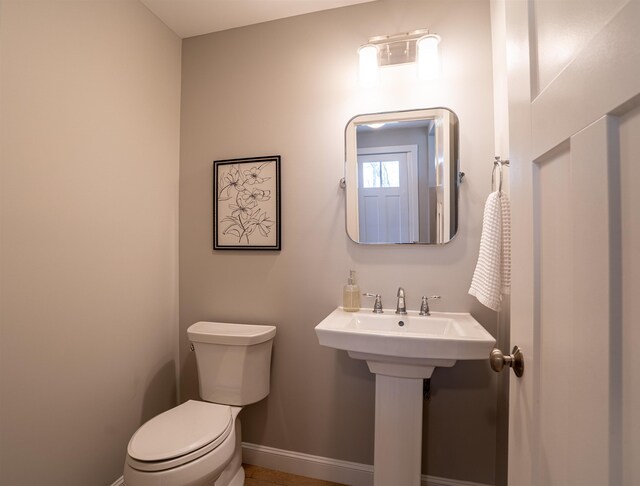 21 Lovering Rd, North Hampton, NH 03862 - half bath with baseboards and toilet