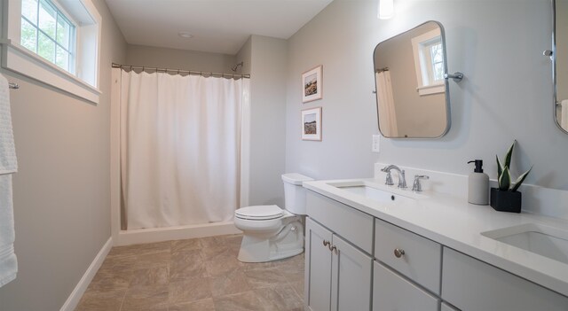 21 Lovering Rd, North Hampton, NH 03862 - full bathroom with a shower with curtain, plenty of natural light, toilet, and double vanity