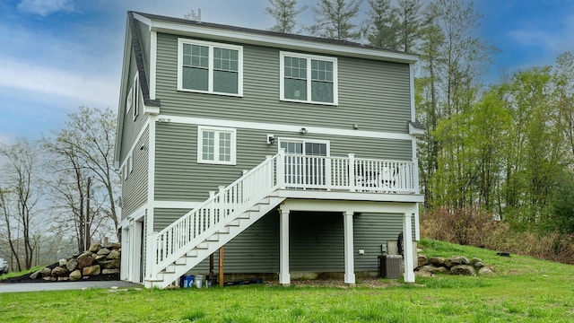 21 Lovering Rd, North Hampton, NH 03862 - rear view of house featuring stairway, a wooden deck, a lawn, and cooling unit
