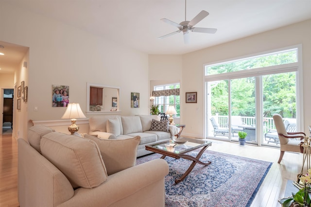 7 Ebenezers Way, Hollis, NH 03049 - living area with light wood-style flooring, a ceiling fan, and a high ceiling