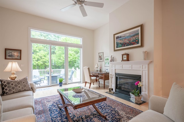 7 Ebenezers Way, Hollis, NH 03049 - living area with wood finished floors, a fireplace with flush hearth, and ceiling fan