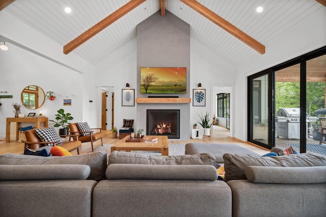 living room featuring high vaulted ceiling, a large fireplace, light wood-style flooring, beamed ceiling, and recessed lighting