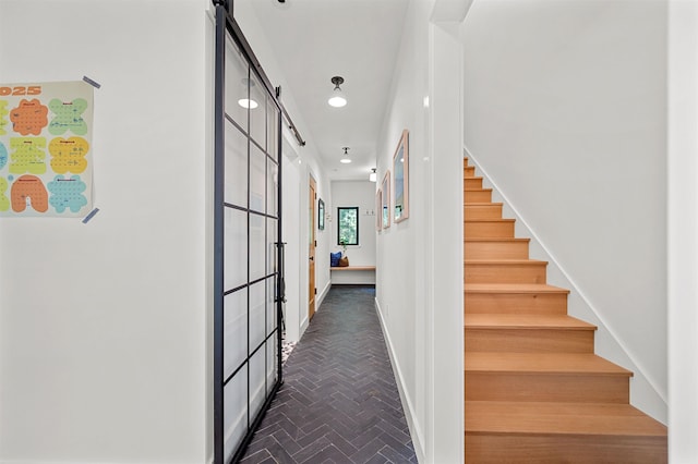 stairs featuring brick floors, recessed lighting, and baseboards