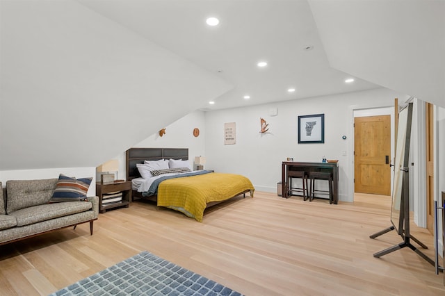 bedroom with light wood-style floors, recessed lighting, and baseboards