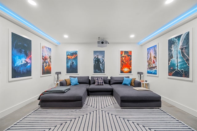 home theater with recessed lighting and baseboards