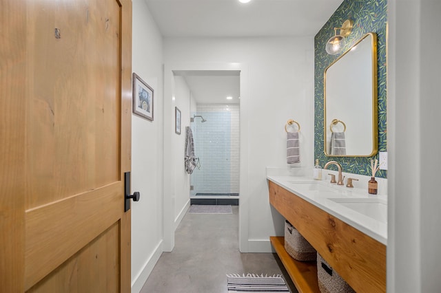 full bath featuring a shower stall, concrete flooring, baseboards, double vanity, and recessed lighting
