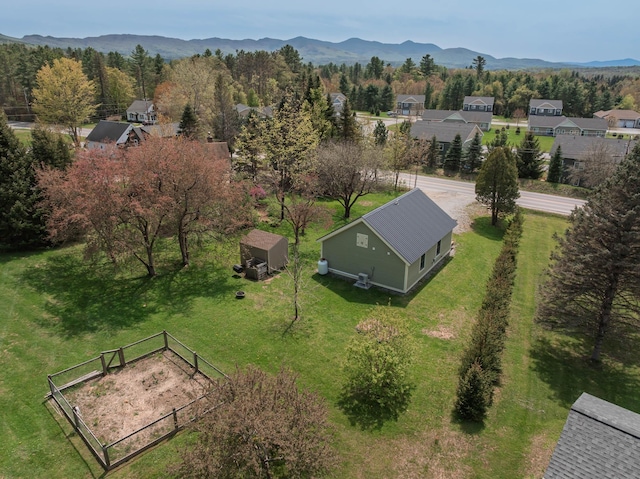 aerial perspective of suburban area with a mountainous background