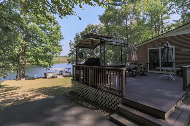 111 Shore Dr, Henniker, NH 03242 - wooden terrace featuring a water view and outdoor dining area