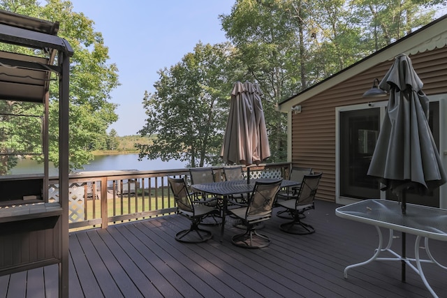 111 Shore Dr, Henniker, NH 03242 - wooden deck with outdoor dining area and a water view
