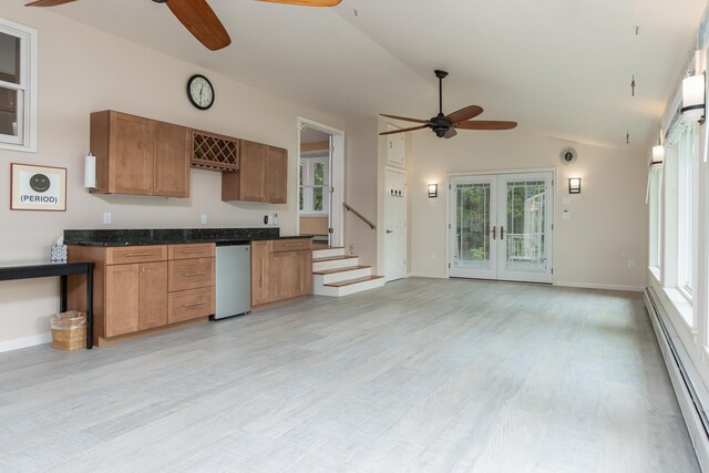 111 Shore Dr, Henniker, NH 03242 - kitchen featuring ceiling fan, a baseboard radiator, plenty of natural light, and vaulted ceiling