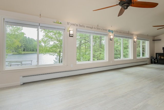 111 Shore Dr, Henniker, NH 03242 - unfurnished sunroom featuring a baseboard radiator, vaulted ceiling, plenty of natural light, and a water view