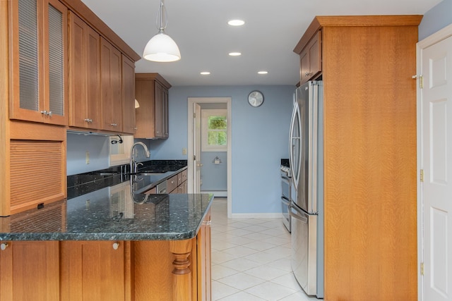 111 Shore Dr, Henniker, NH 03242 - kitchen featuring freestanding refrigerator, brown cabinets, light tile patterned flooring, a sink, and recessed lighting