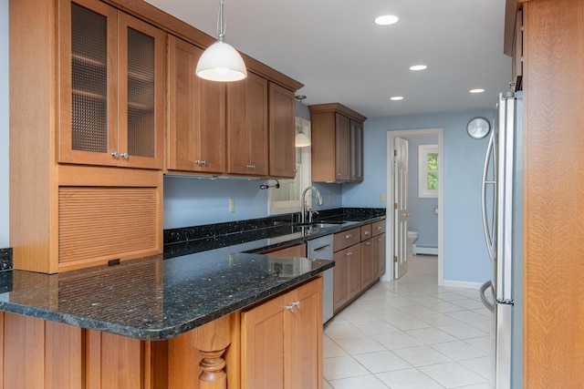 111 Shore Dr, Henniker, NH 03242 - kitchen with appliances with stainless steel finishes, a sink, a baseboard heating unit, light tile patterned floors, and glass insert cabinets
