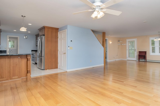 111 Shore Dr, Henniker, NH 03242 - unfurnished living room featuring light wood-style flooring, recessed lighting, a ceiling fan, baseboards, and a baseboard heating unit