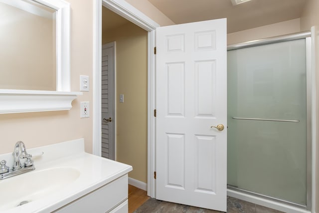 111 Shore Dr, Henniker, NH 03242 - full bathroom with a shower with door, vanity, and wood finished floors