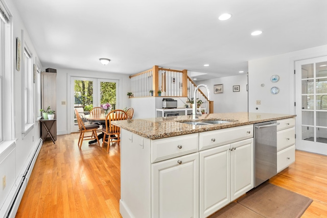 4 Oleary Ave, Hanover, NH 03755 - kitchen with a baseboard heating unit, dishwasher, a sink, a center island with sink, and white cabinets