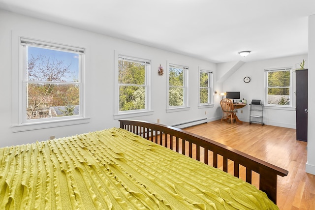 4 Oleary Ave, Hanover, NH 03755 - bedroom featuring a baseboard heating unit, wood finished floors, and an office area
