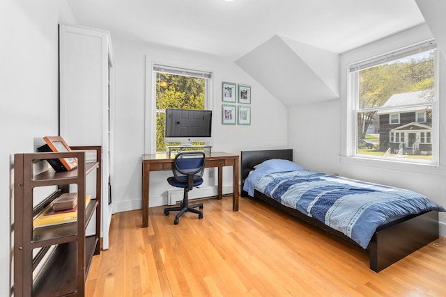 4 Oleary Ave, Hanover, NH 03755 - bedroom featuring light wood-type flooring, a baseboard radiator, multiple windows, and lofted ceiling