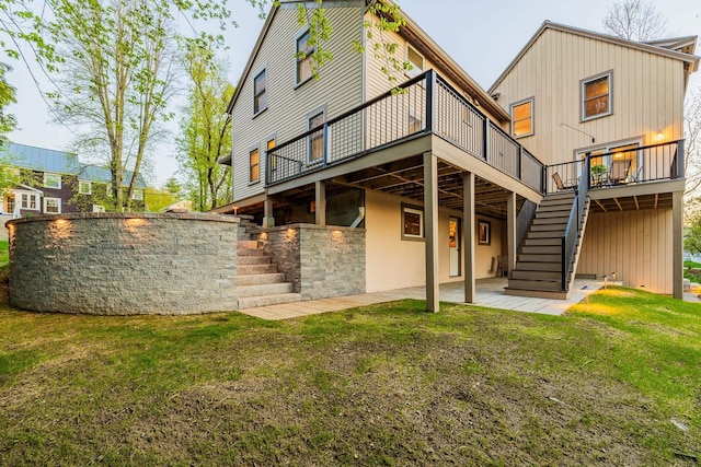 4 Oleary Ave, Hanover, NH 03755 - rear view of house featuring stairs, a wooden deck, a yard, and a patio