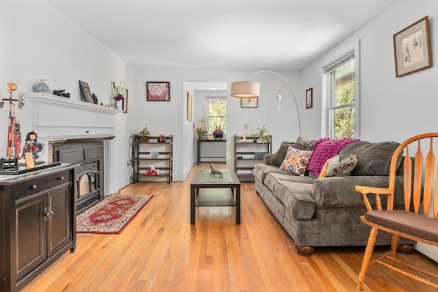 4 Oleary Ave, Hanover, NH 03755 - living room with a fireplace with flush hearth, plenty of natural light, and light wood-style flooring
