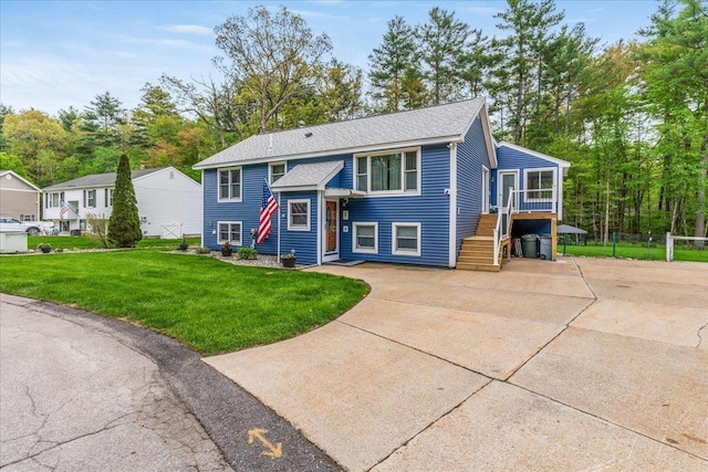 8 Bowman Ct, Merrimack, NH 03054 - split foyer home with a front yard, roof with shingles, and stairs