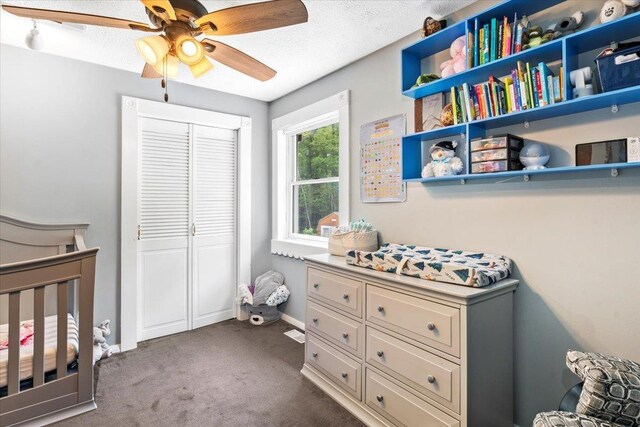 8 Bowman Ct, Merrimack, NH 03054 - bedroom featuring dark colored carpet, a closet, a ceiling fan, and baseboards