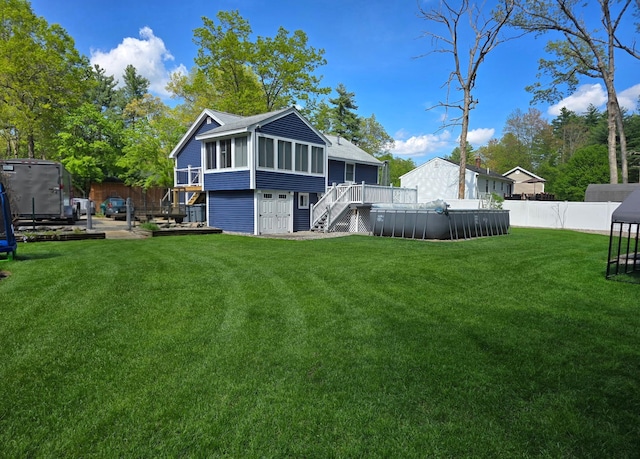 8 Bowman Ct, Merrimack, NH 03054 - back of house featuring a sunroom, stairway, and a wooden deck