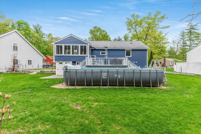 8 Bowman Ct, Merrimack, NH 03054 - rear view of house featuring a wooden deck, an outdoor pool, and a yard