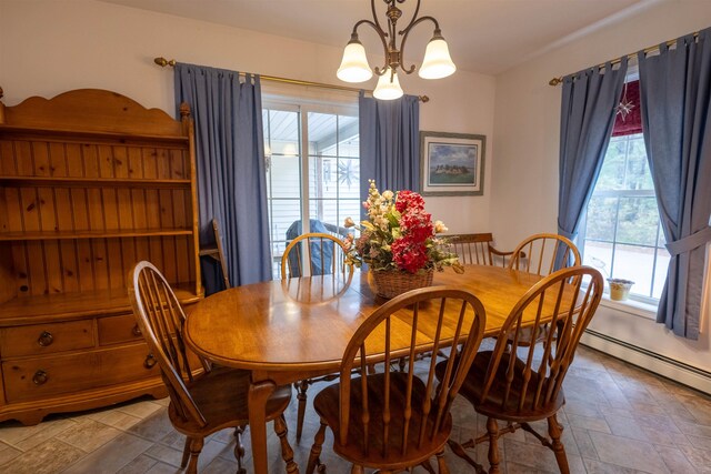 334 Silver Pine Ln, Tamworth, NH 03886 - dining room featuring stone finish floors and a chandelier