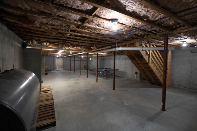 334 Silver Pine Ln, Tamworth, NH 03886 - unfinished below grade area featuring oil tank and stairs