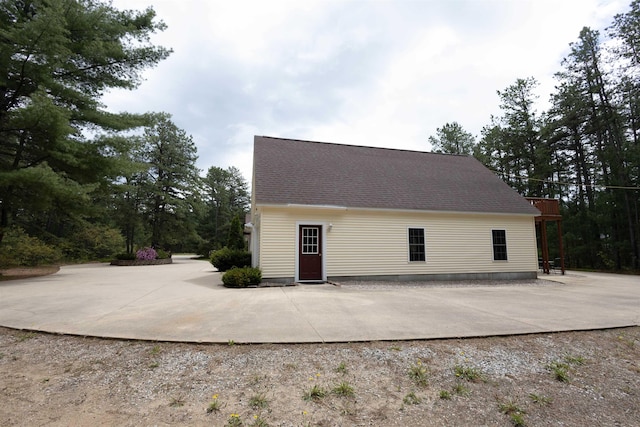 334 Silver Pine Ln, Tamworth, NH 03886 - view of property exterior featuring a patio area and a shingled roof