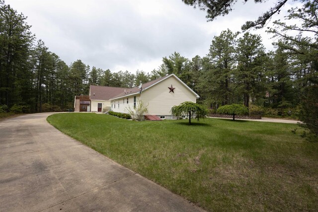 334 Silver Pine Ln, Tamworth, NH 03886 - view of property exterior with a yard and driveway