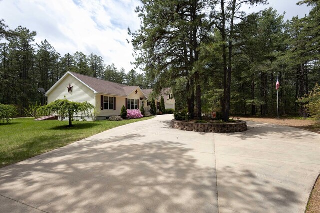 334 Silver Pine Ln, Tamworth, NH 03886 - view of front of house with curved driveway, a front lawn, and crawl space