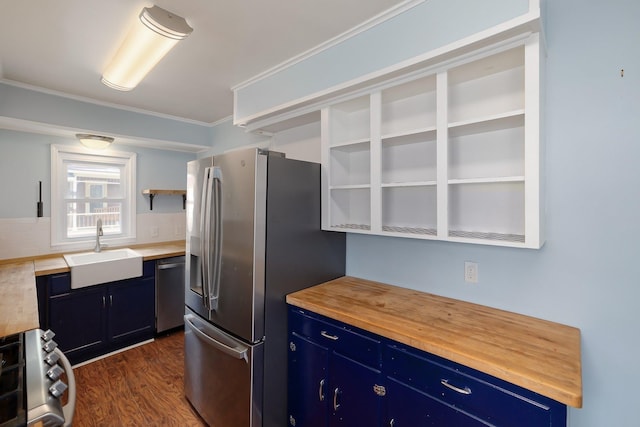 14 Butler St, Waterbury, VT 05676 - kitchen featuring appliances with stainless steel finishes, a sink, blue cabinetry, butcher block counters, and dark wood-style floors