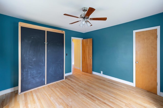 14 Butler St, Waterbury, VT 05676 - unfurnished bedroom with baseboards, a closet, wood finished floors, and ceiling fan