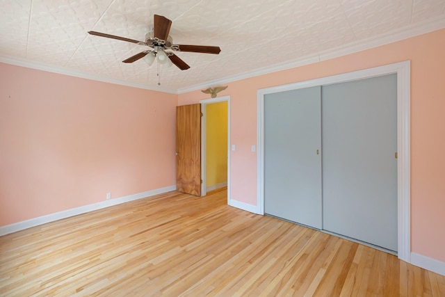 14 Butler St, Waterbury, VT 05676 - unfurnished bedroom featuring wood finished floors, ornamental molding, baseboards, a closet, and ceiling fan