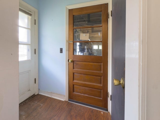 14 Butler St, Waterbury, VT 05676 - doorway featuring dark wood-style flooring and baseboards
