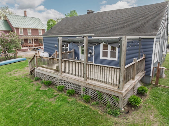 14 Butler St, Waterbury, VT 05676 - back of house featuring a wooden deck, a shingled roof, a lawn, and a chimney