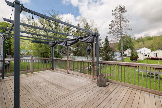 14 Butler St, Waterbury, VT 05676 - wooden deck with a pergola, a lawn, and a residential view