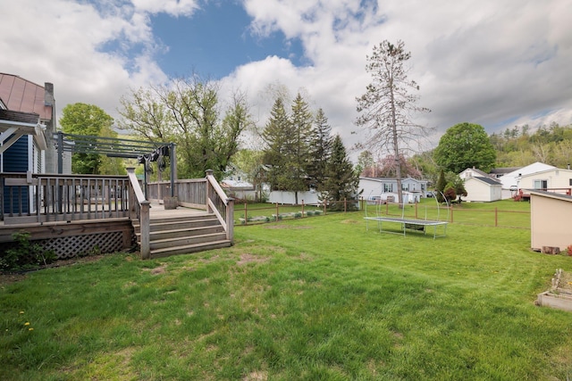 14 Butler St, Waterbury, VT 05676 - view of yard featuring a trampoline and a deck