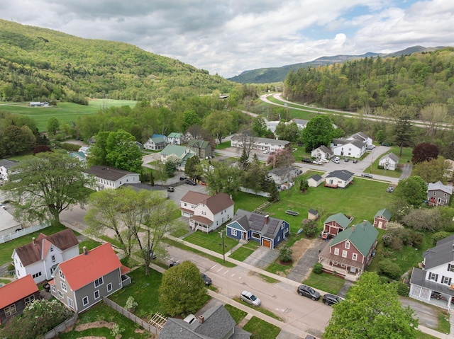 14 Butler St, Waterbury, VT 05676 - aerial perspective of suburban area featuring a heavily wooded area and a mountainous background