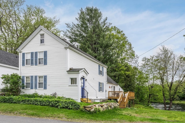 33 Tanner St, Concord, NH 03303 - view of side of property featuring a deck with water view