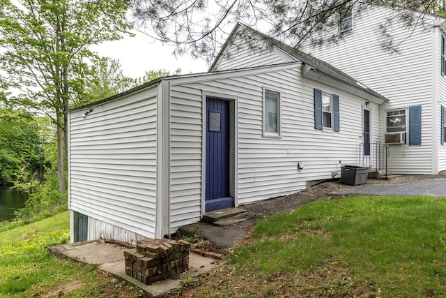 33 Tanner St, Concord, NH 03303 - view of home's exterior featuring cooling unit and a lawn