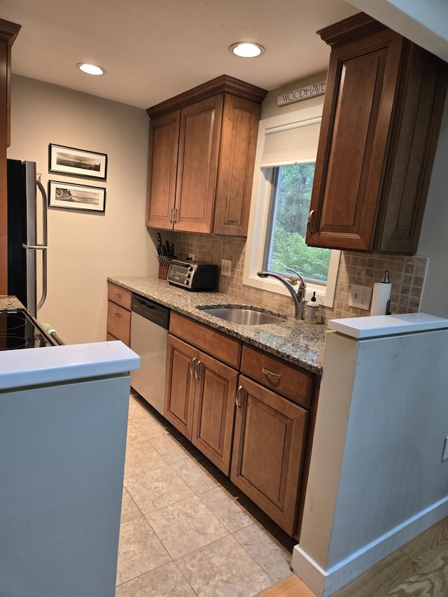 46 Point Breeze Rd, Wolfeboro, NH 03894 - kitchen featuring black appliances, a sink, backsplash, recessed lighting, and light stone counters