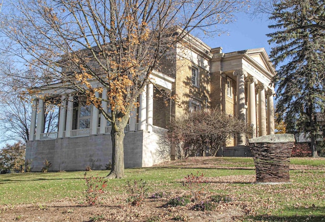 view of home's exterior featuring a lawn